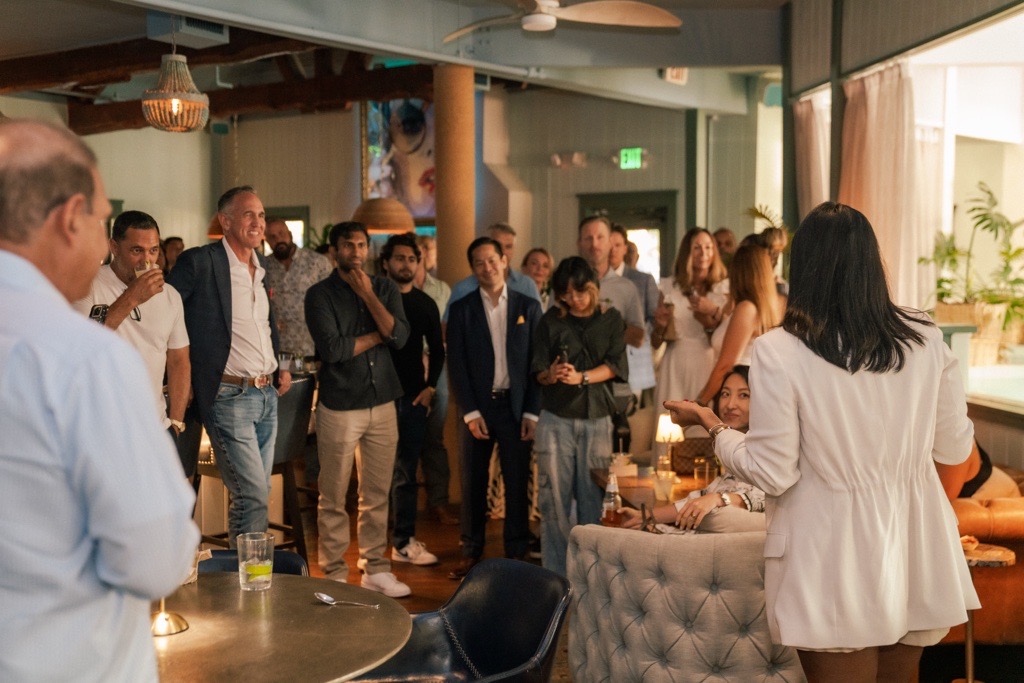 Dana Udumulla speaking with investors and business owners at an event