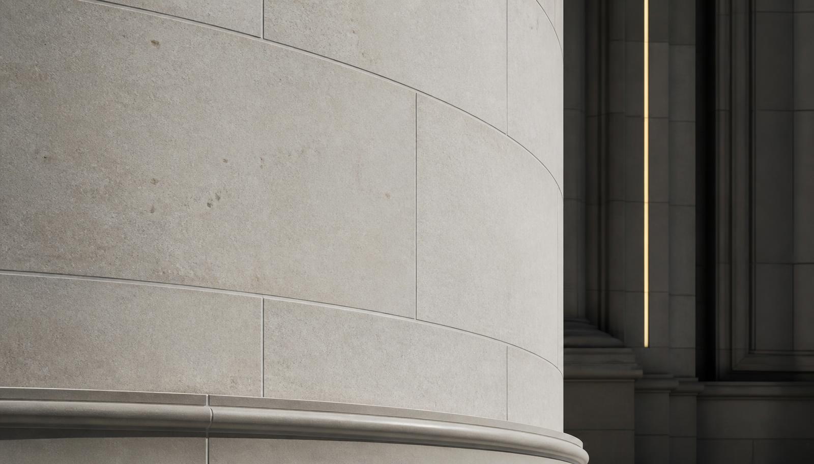 Detail of a pale limestone facade with deep shadow lines