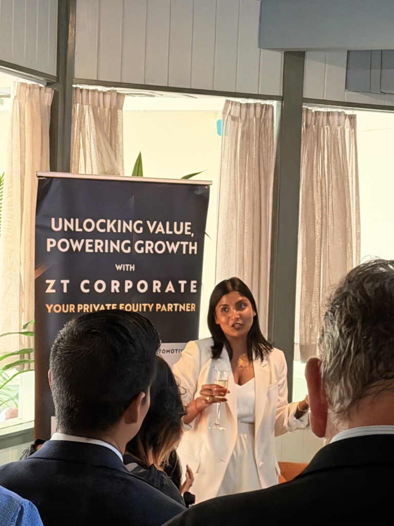 Dana Udumulla addressing guests at an investor event